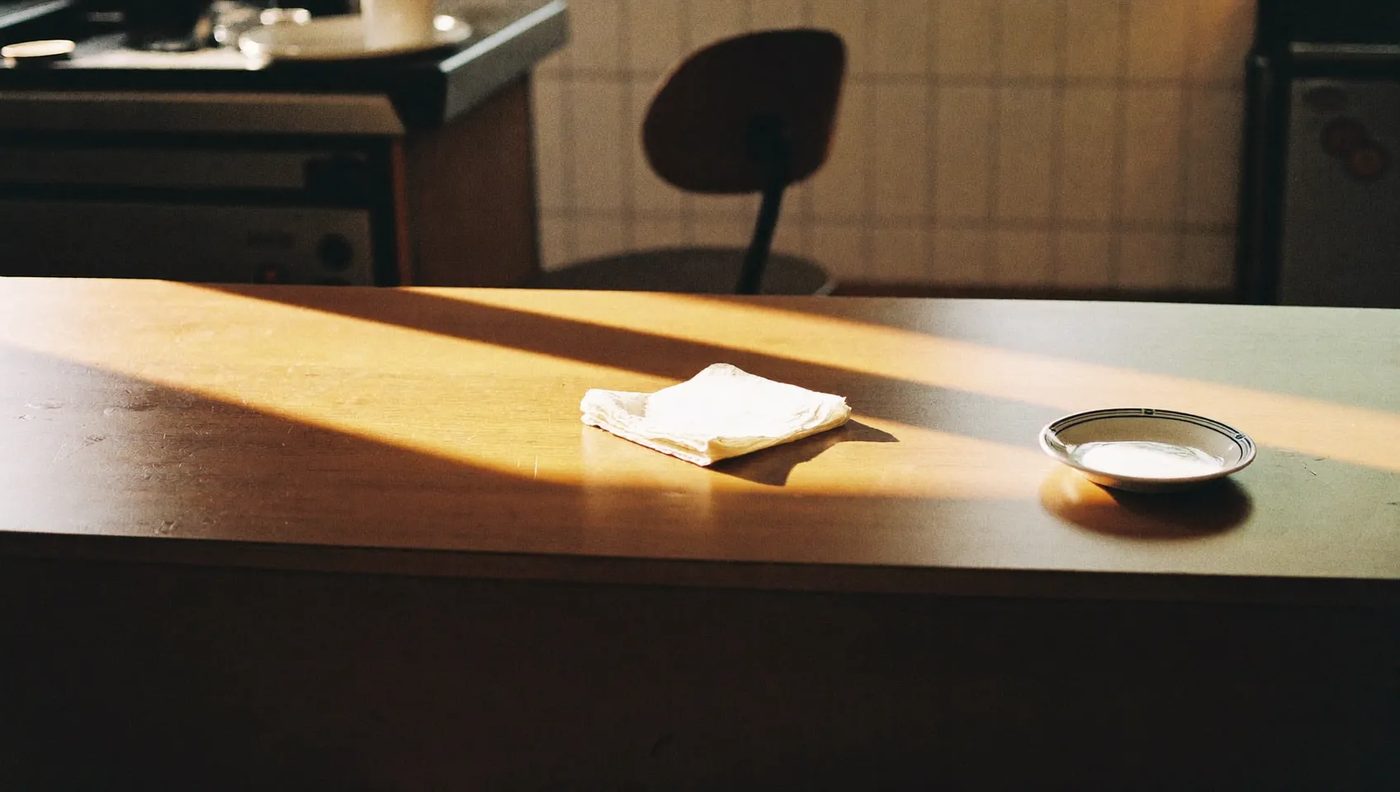 Morning light across the counter at a small coffee shop